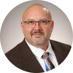 A headshot of Robert McBreen